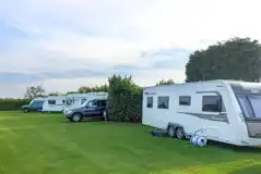 Grass and hardstanding touring pitches - optional electric Grass and hardstanding touring pitches - optional electric