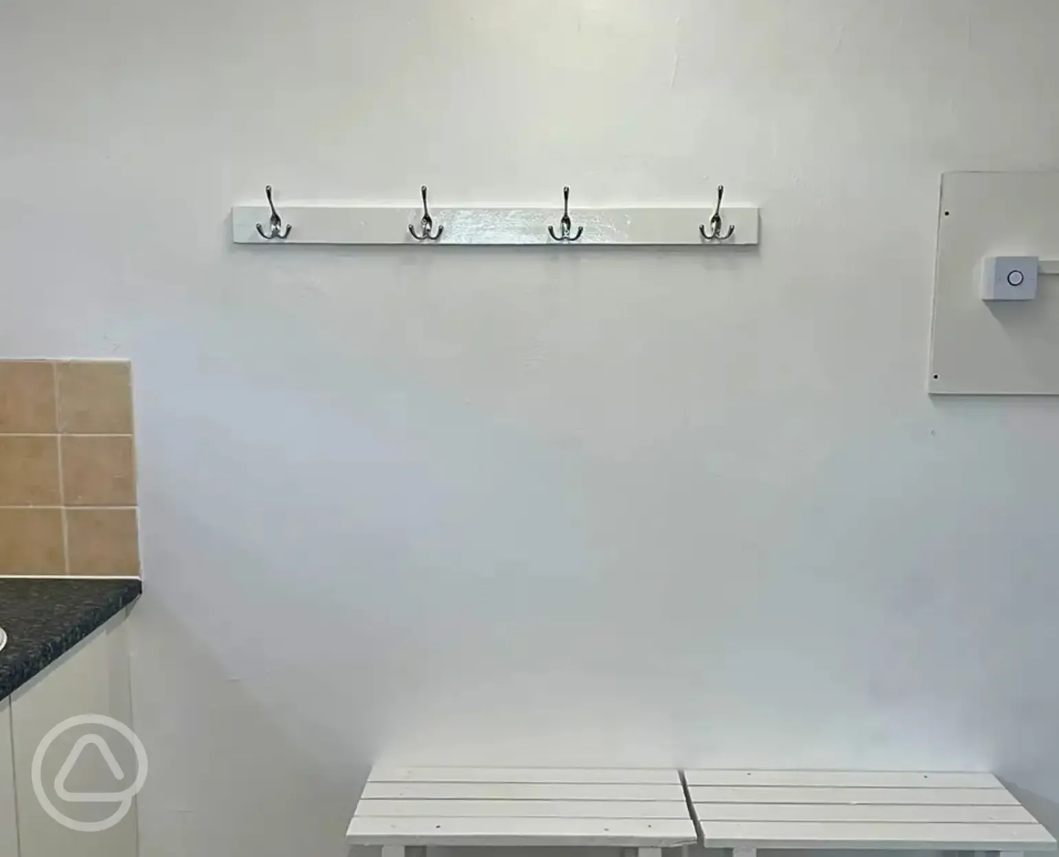 Shower changing area with hooks and benches