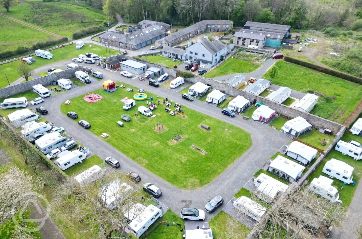 Aerial of the touring pitches with grass pitches in the centre