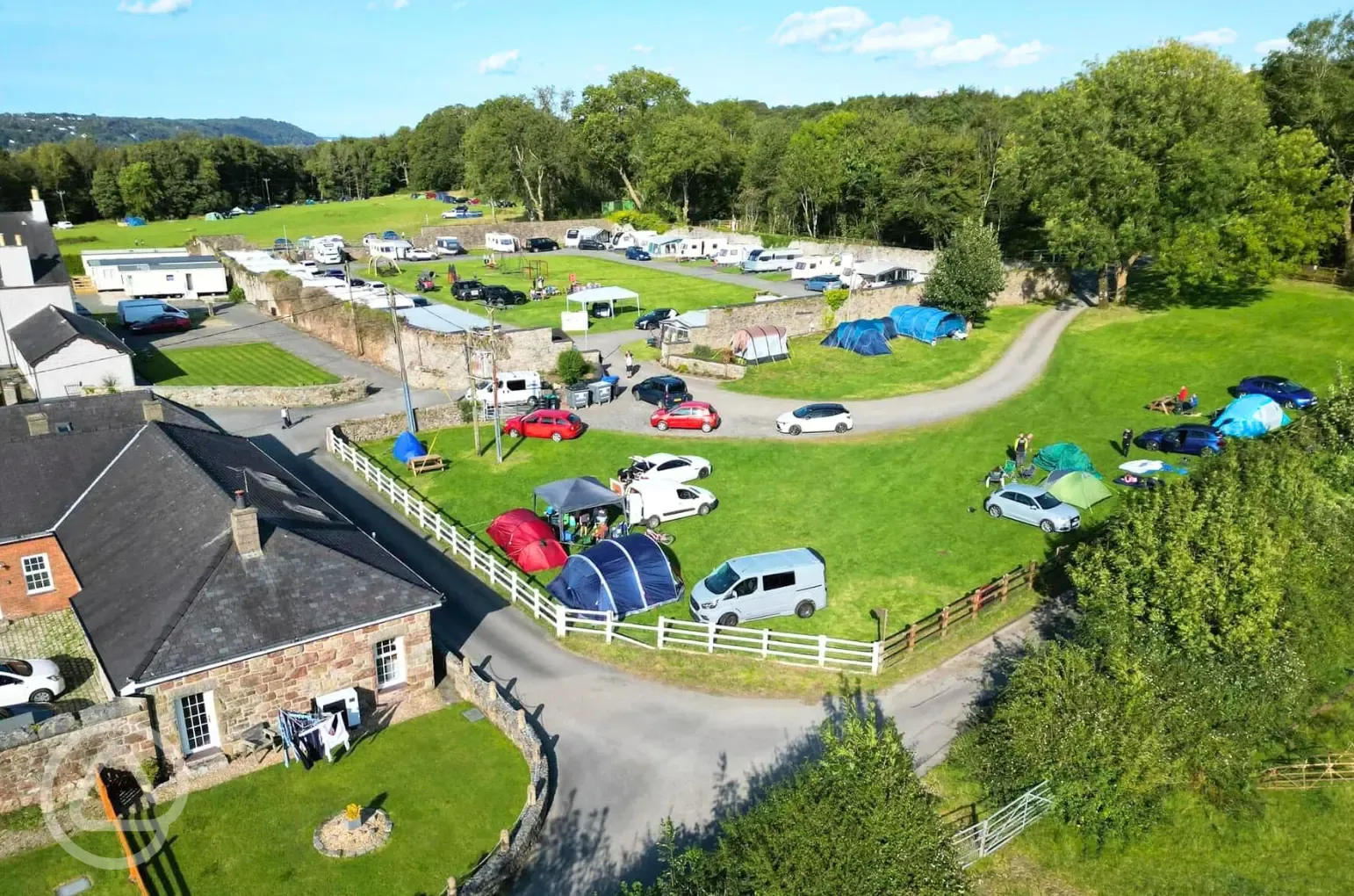 Grass pitches for tents and tourers with space to park a car along side