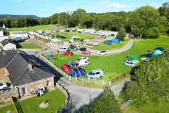 Grass pitches for tents and tourers with space to park a car along side