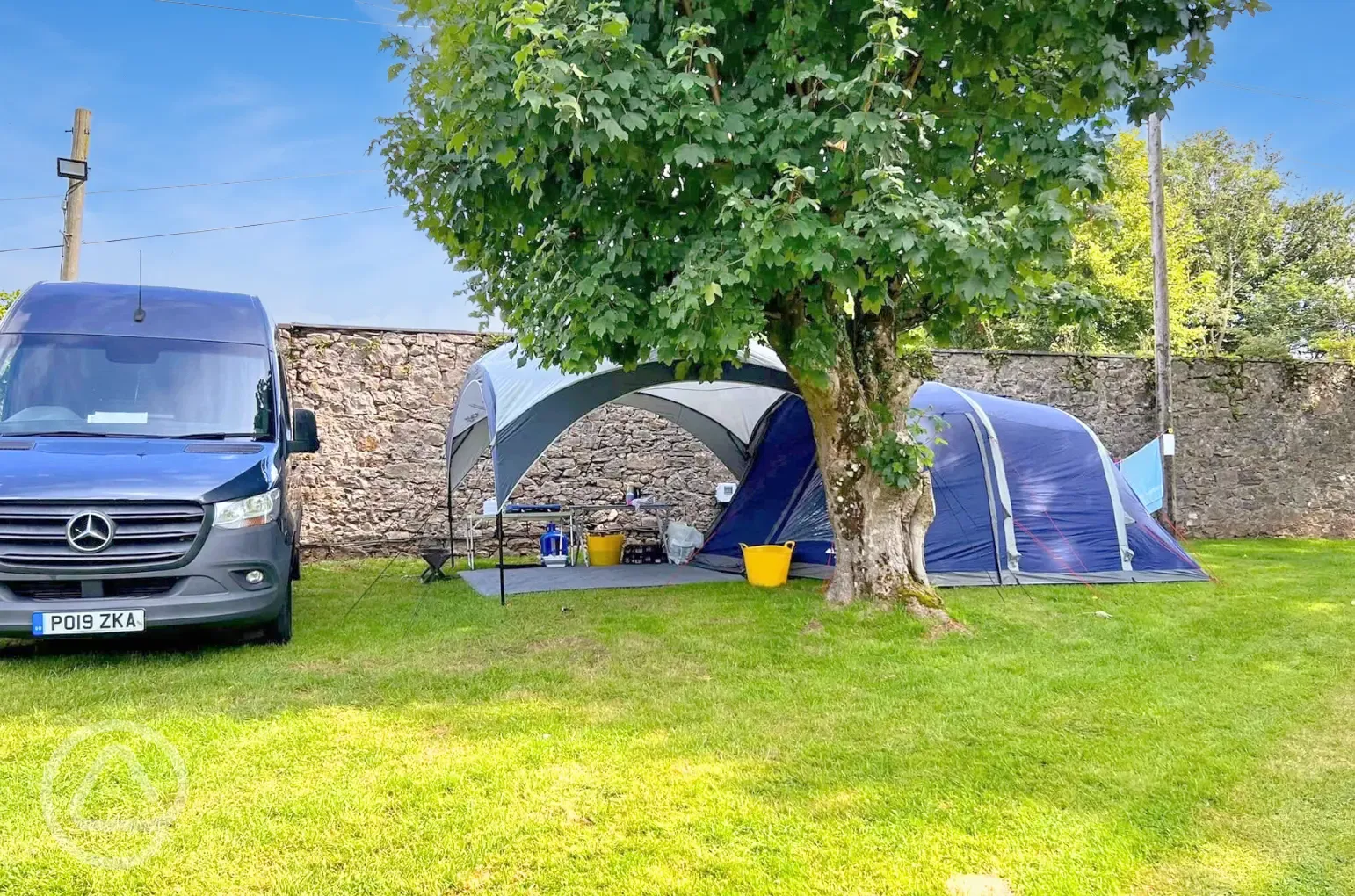 Electric grass pitches for up to six people with 16amp electric hook up