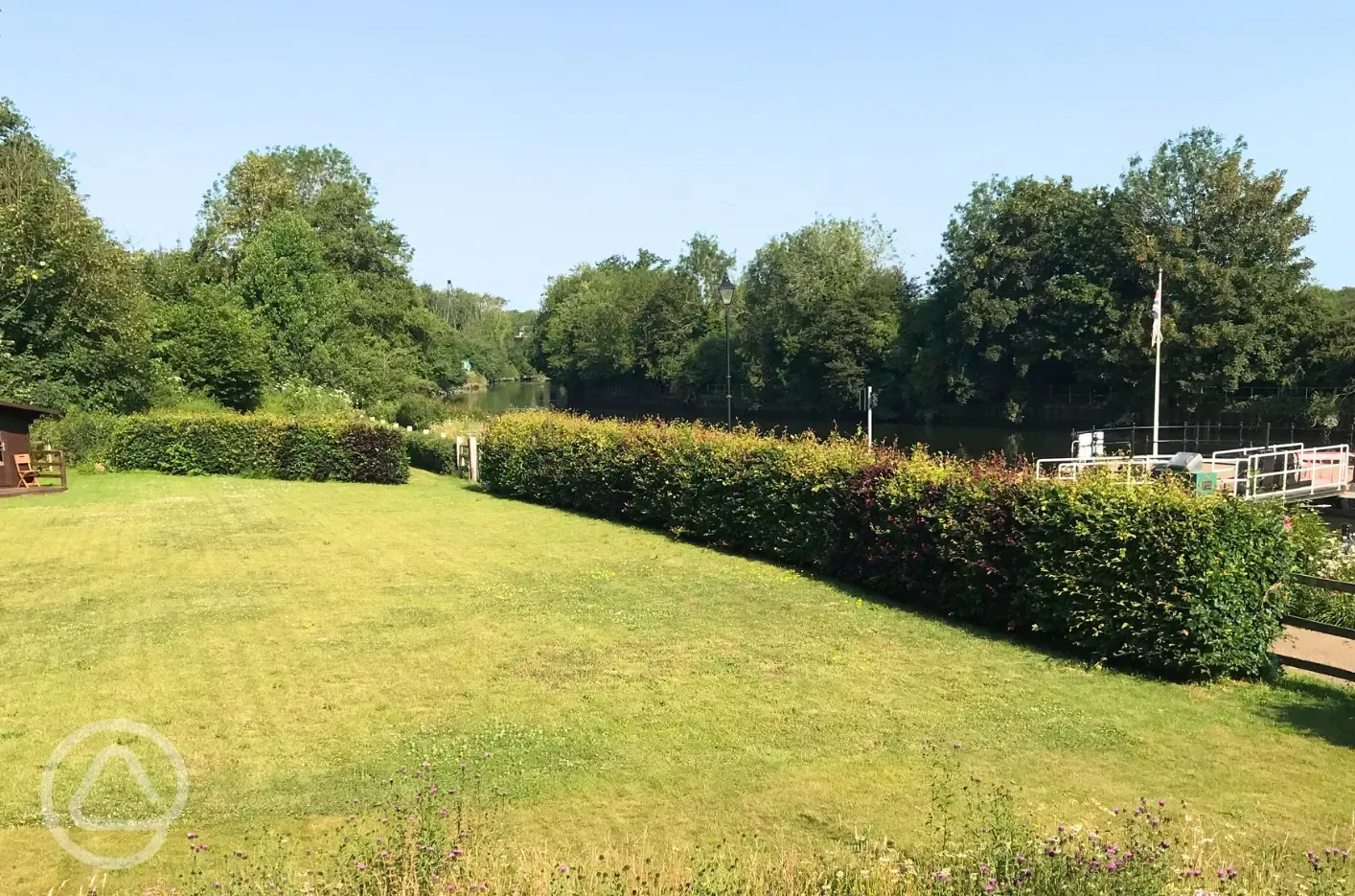Non electic grass pitches by the river