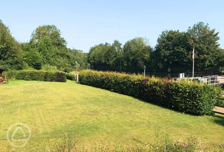 Non electic grass pitches by the river