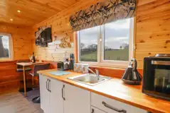 Stag lodge kitchenette area with a hob, kettle, and fridge/freezer Stag lodge kitchenette area with a hob, kettle, and fridge/freezer