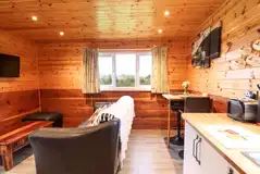 Stag lodge lounge area with a smart TV and sofa Stag lodge lounge area with a smart TV and sofa