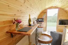 Embden glamping pod interior with a dining area and smart TV Embden glamping pod interior with a dining area and smart TV