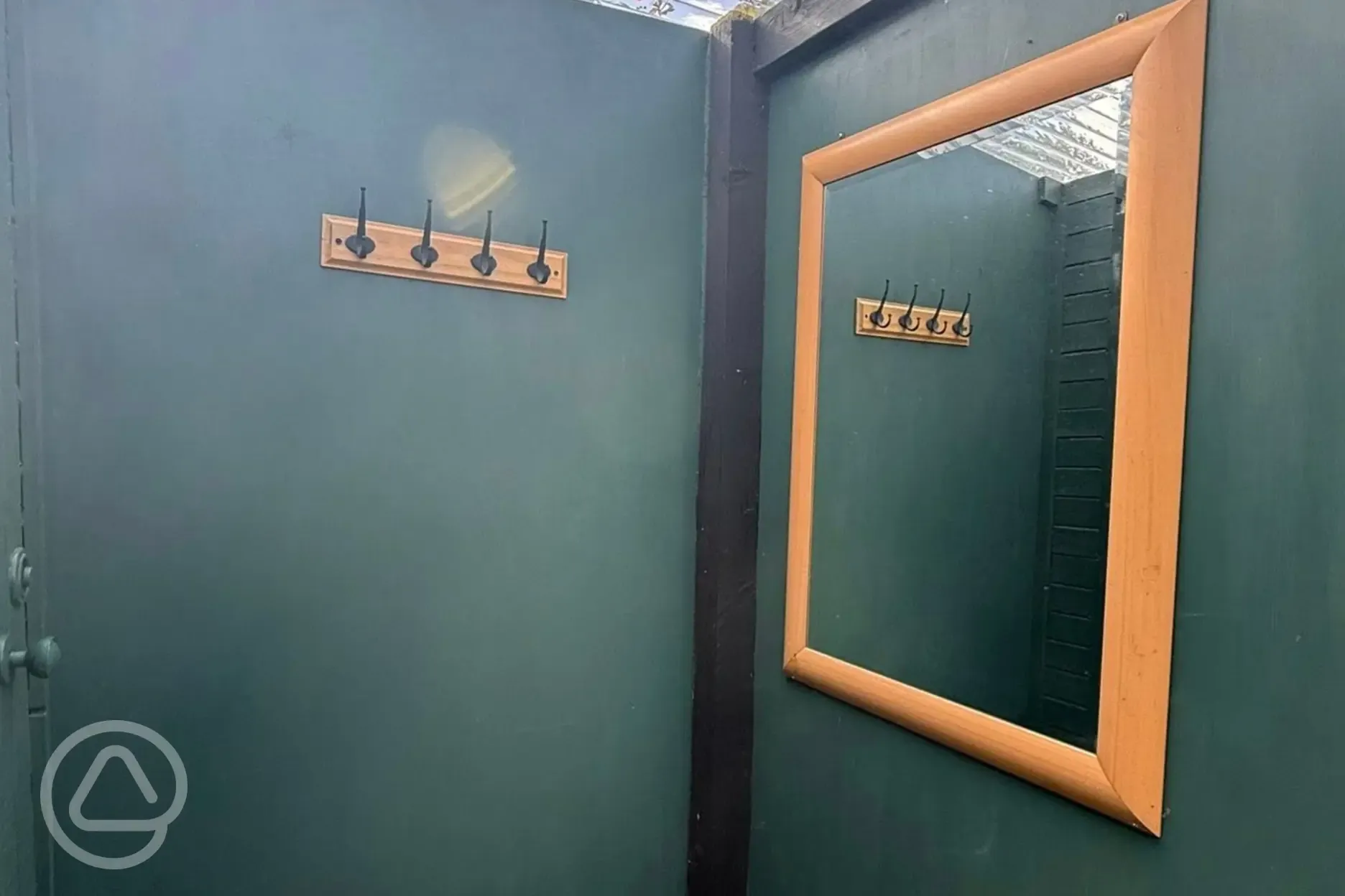 Hooks and mirror in facility block