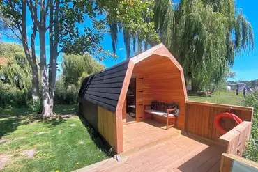 Lakeside camping pods with picnic bench