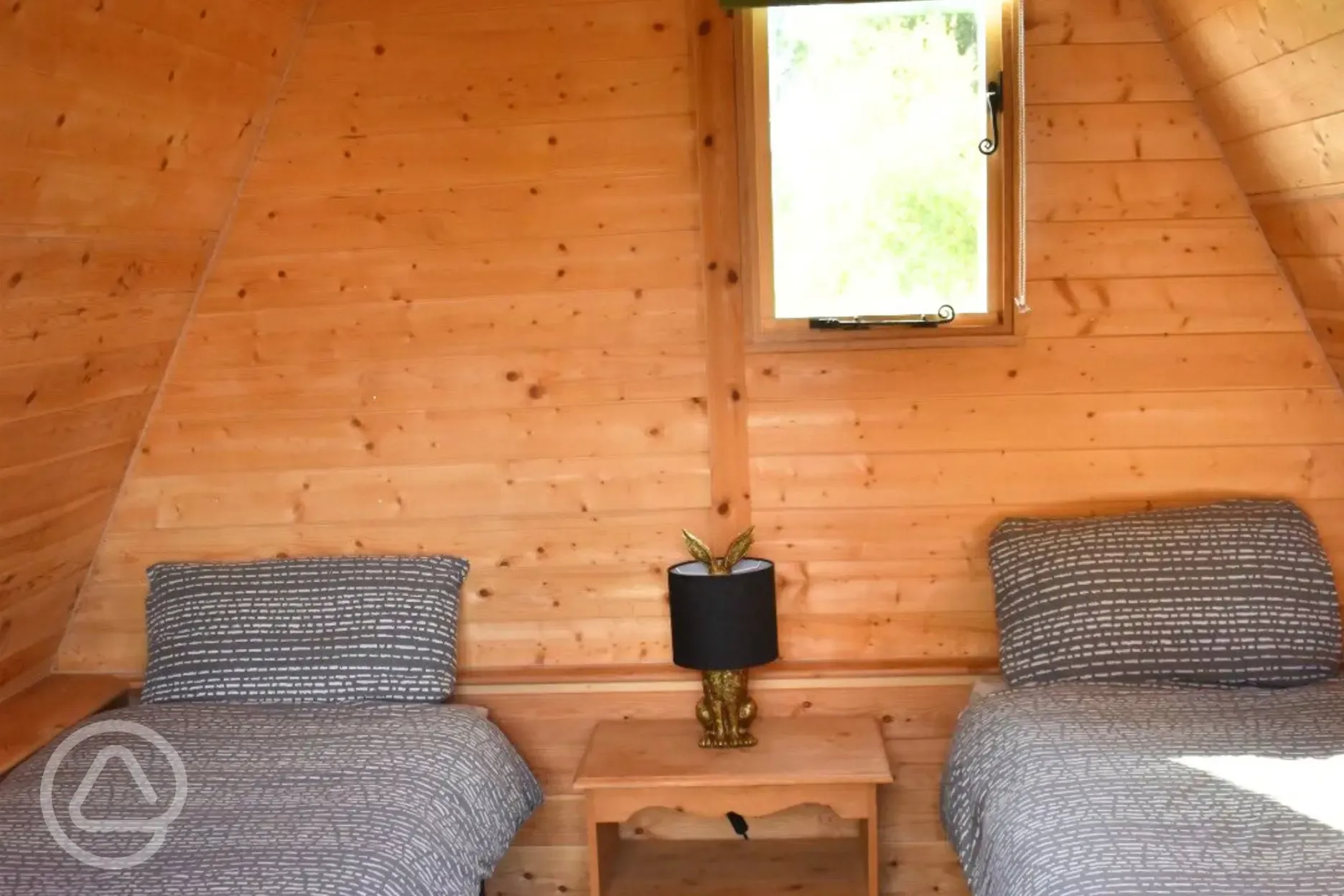Single beds in Ed's camping pod (bedding included)
