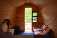 Valerie's pod interior with outdoor seating and lake views Valerie's pod interior with outdoor seating and lake views