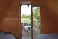 View of the decking area and the lake from Ed's camping pod