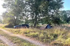 Small tent on a non electric grass pitch with space for a parked car