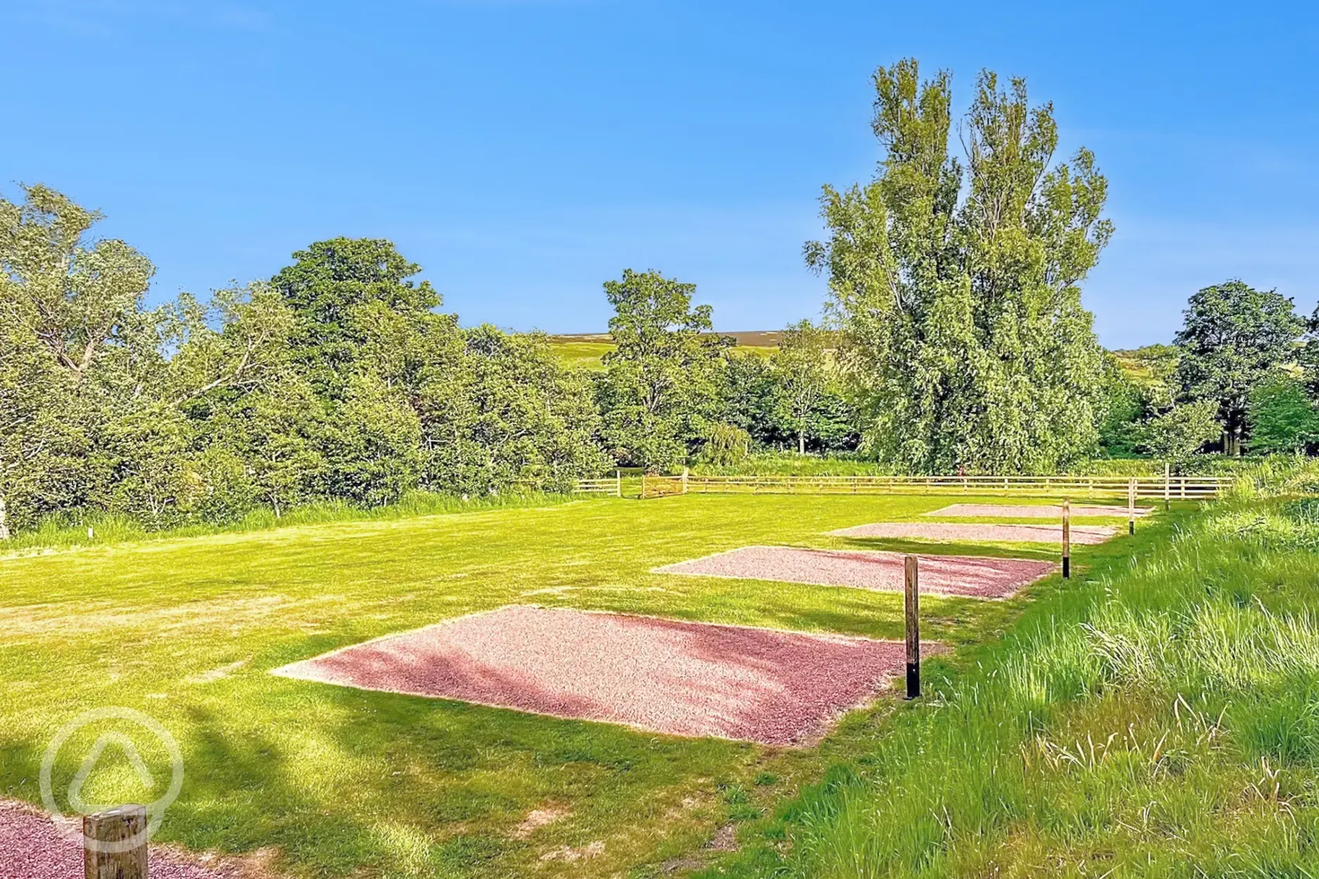 Non electric gravel hardstanding pitches with views of the Cheviot Hills