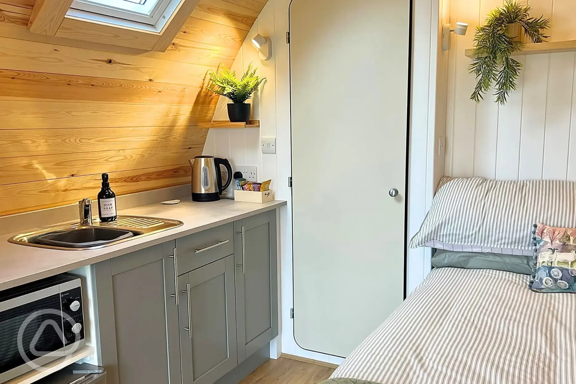 Equipped kitchenette with a sink, fridge, microwave, air fryer and toaster