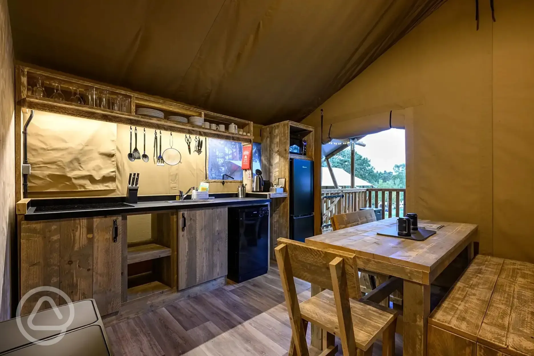 Premium Safari Tent dining area and equipped kitchen