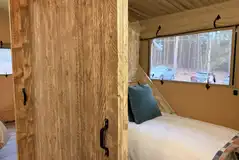 Single bedroom in the Accessible Deluxe Safari Tent