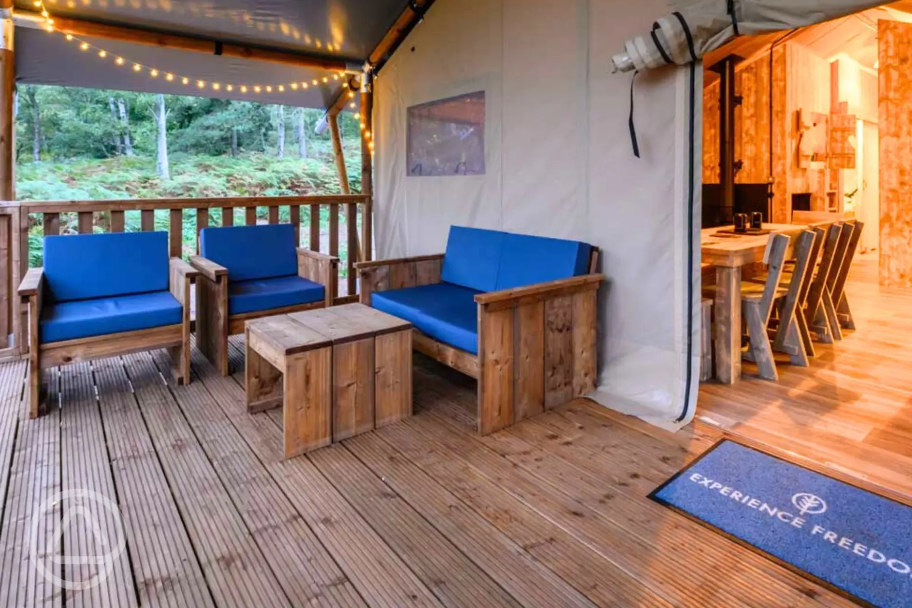 Large Deluxe Safari Tent with an outdoor sofa area