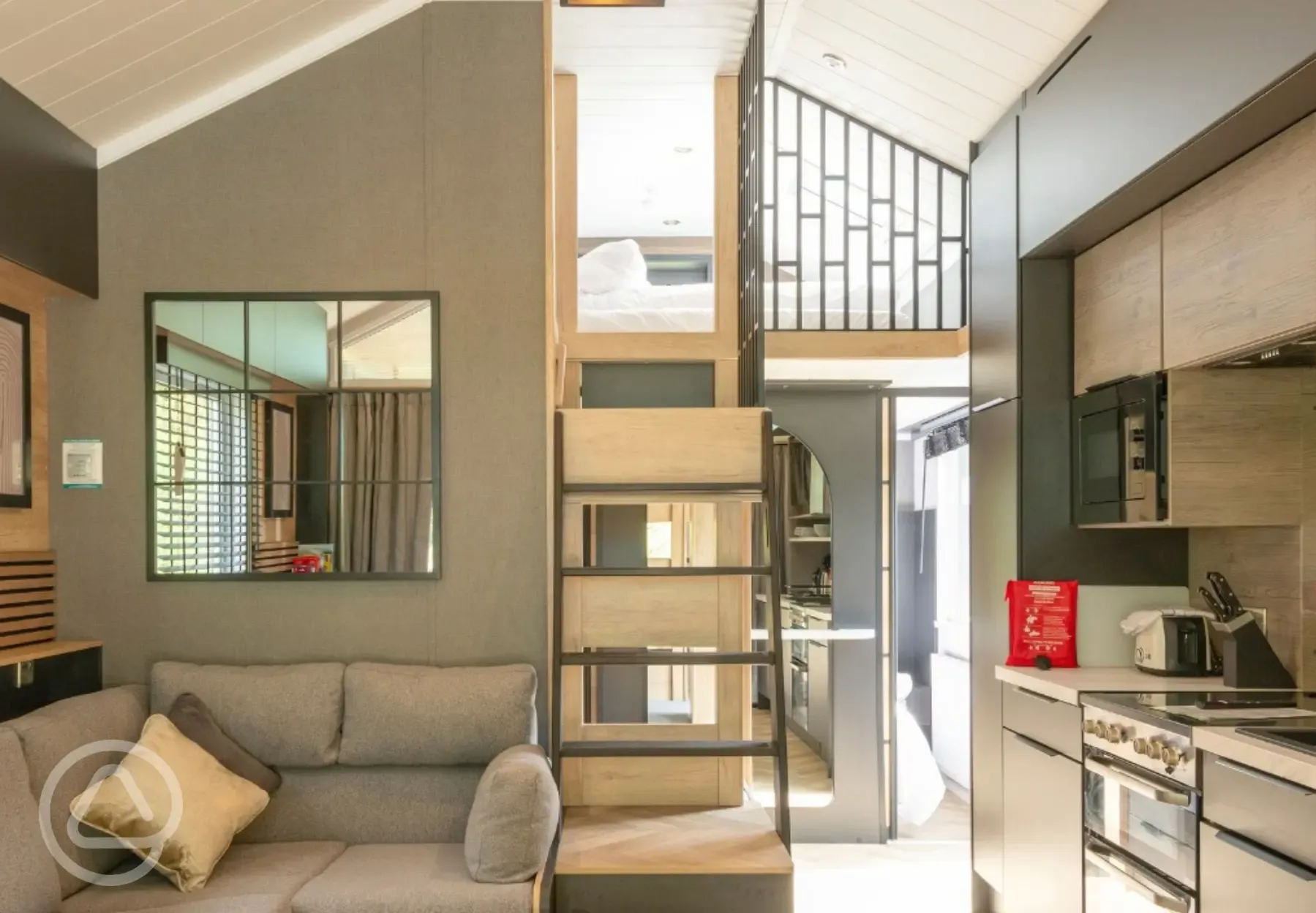 Superior glamping cabin with a double sofa bed and equipped kitchen