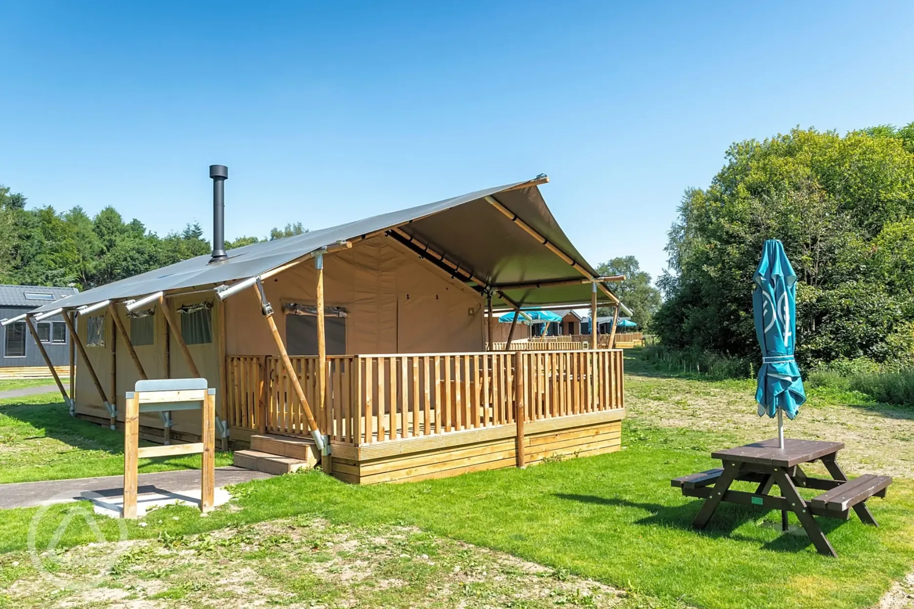 Deluxe safari tent with an outdoor verandah, deck and brick BBQ station