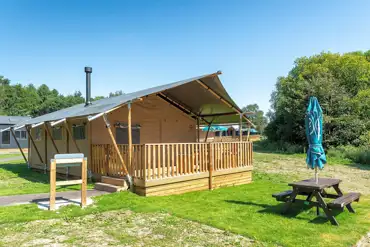 Deluxe safari tent with an outdoor verandah, deck and brick BBQ station