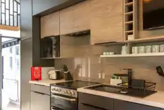 Kitchen with an oven, hob, toaster, fridge, kettle and microwave