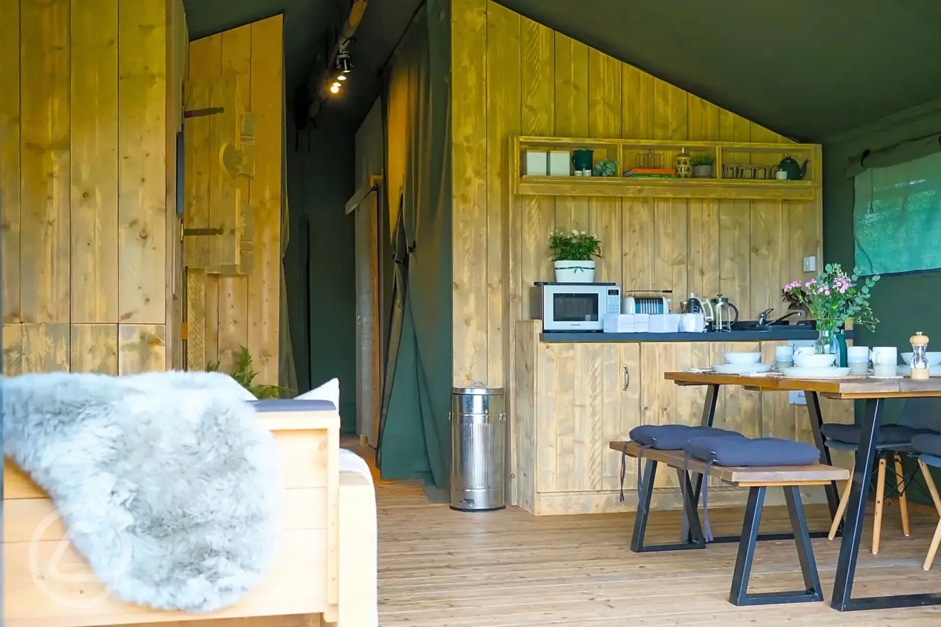 Large Deluxe safari tent with a dining area and kitchen