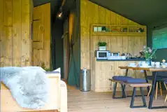 Large Deluxe safari tent with a dining area and kitchen