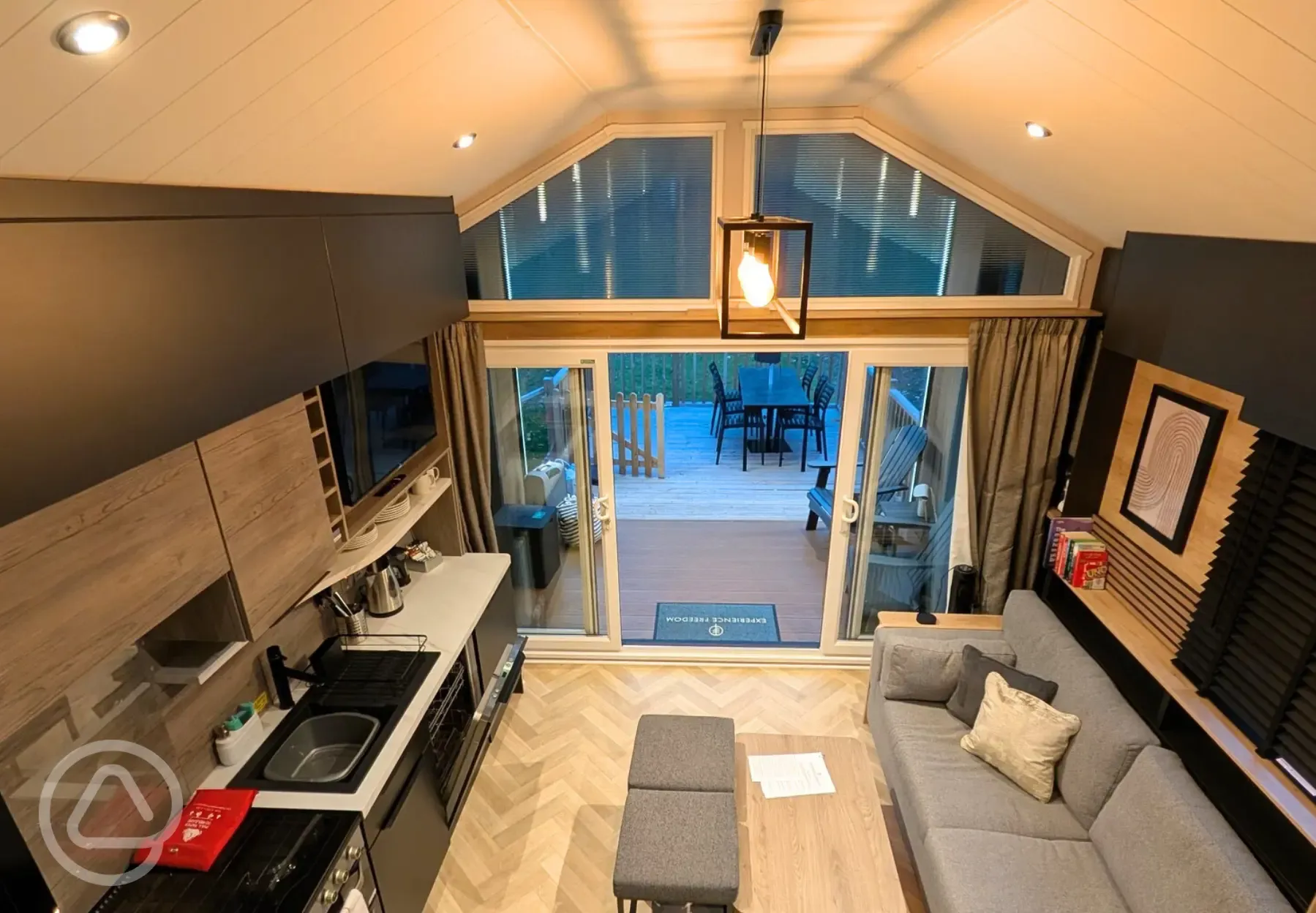 Superior glamping cabin with a double sofa bed and equipped kitchen