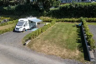 Fully serviced hardstanding and grass pitches with space for an awning