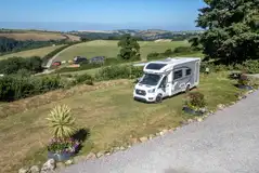 Grass pitches with optional electric at Dartmouth Caravan Park Grass pitches with optional electric at Dartmouth Caravan Park