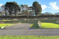 Hardstanding and grass pitches with small dividing walls between