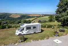 Grass pitches with optional electric and a picnic bench