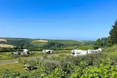 Dartmouth Caravan Park mix of grass and hardstanding with countryside views