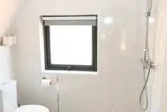 Ensuite wetroom with a toilet, shower, hand basin and two shower heads Ensuite wetroom with a toilet, shower, hand basin and two shower heads