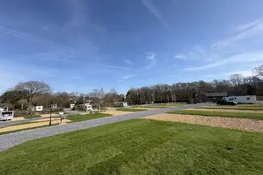 Llanina Caravan Park with large grass areas between pitches