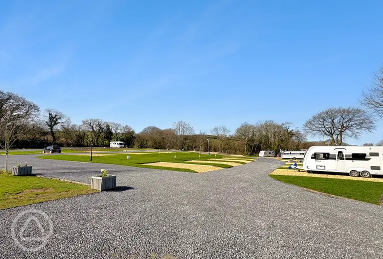 Electric hardstanding and grass pitches (8m x 5m)