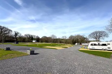 Electric hardstanding and grass pitches (8m x 5m)