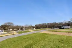 Llanina Caravan Park with large grass areas between pitches