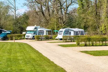 Fully serviced hardstanding pitches with dividing hedges