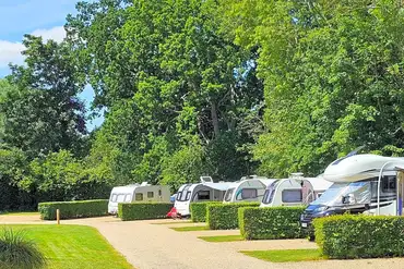 Fully serviced hardstanding pitches with dividing hedges