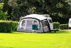 Grass pitches with 16 amp hook ups, water, grey waste, WiFi and TV points