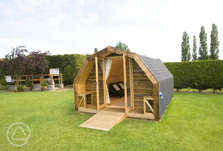 Camping pod with double glass doors and two single sofa beds