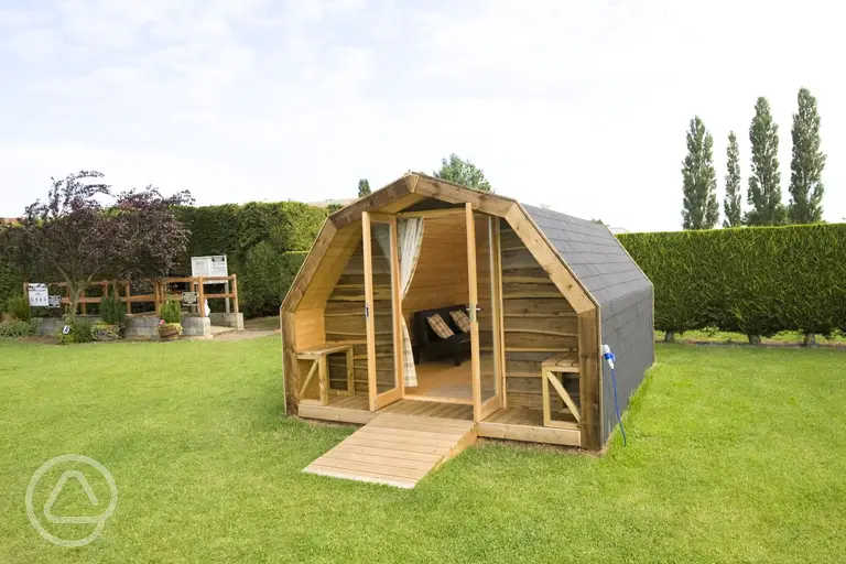Camping pod with double glass doors and two single sofa beds