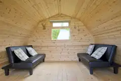 Camping pod with two single sofa beds (roof for extra camp beds)
