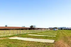 Hardstanding 10m x 10m pitches with 16 amp hook ups