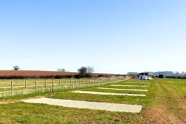 Hardstanding 10m x 10m pitches with 16 amp hook ups