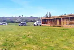 Electric hardstanding pitches by the facilities building