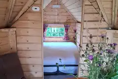Wooden eco house interior (please bring camping equipment minus the tent)