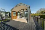 Snug ensuite glamping cabin with a deck and double egg chair